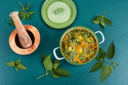 Photo for Nettle soup in a saucepan. Concept of healthy food. - Royalty Free Image
