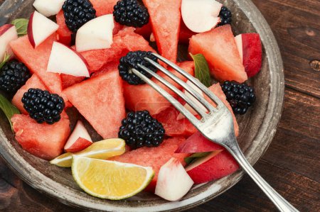 Photo for Colorful salad of watermelon, blackberry and peach. Vegan food, detox food. - Royalty Free Image