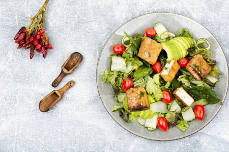 Photo for Green salad with roasted cheese tofu, vegetables and herbs - Royalty Free Image