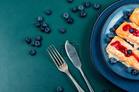 Photo for Fried salmon fillet with blueberry berry sauce. Healthy food. Space for text. - Royalty Free Image