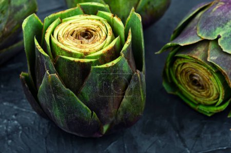 Photo for Uncooked unopened artichoke buds, food. Italian cuisine - Royalty Free Image