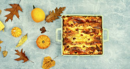 Photo for Autumn pie made from pumpkin, pita bread and cheese. Delicious seasonal pastries - Royalty Free Image