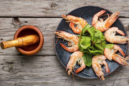 Photo for Boiled tails of king shrimps on an old rustic table - Royalty Free Image