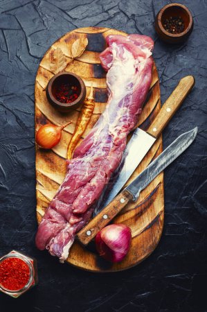 Photo for Fresh raw pork tenderloin and spiced ingredients. - Royalty Free Image