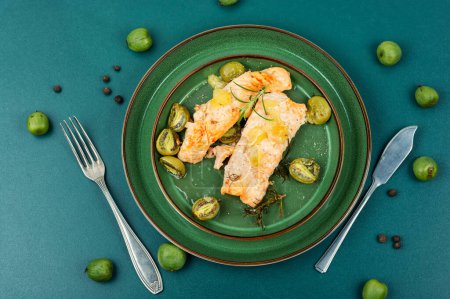 Photo for Salmon fillets baked with mini kiwi. Diet food. Top view. - Royalty Free Image