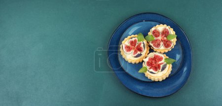 Photo for Tartlets with cream and figs. Sweet tartlets with fresh berries. Copy space. - Royalty Free Image