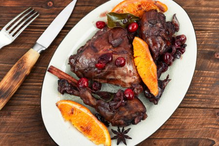 Photo for Chicken legs or drumsticks marinated in red wine, baked with orange and berries. Flat lay. Rustic style - Royalty Free Image