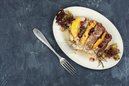Photo for Tasty meat roll fried with fresh mango pieces. Classic meatloaf. Copy space - Royalty Free Image
