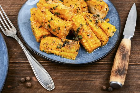 Photo for Ears of corn baked with herbs. Vegetarian food, recipes. - Royalty Free Image