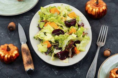 Photo for Seasonal autumn salad of roasted pumpkin, beets and lettuce. Autumn food concept. - Royalty Free Image