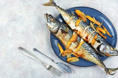 Photo for Delicious mackerel fish baked with mango slices. Top view. Space for text - Royalty Free Image