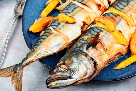Photo for Appetizing mackerel fish roasted with mango. Healthy homemade food. Cookbook recipe. - Royalty Free Image