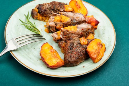 Photo for Grilled beef meat steak with peach in fruit marinade. Barbecue - Royalty Free Image