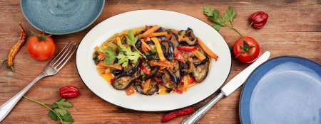 Photo for Vegetable saute with eggplant. Vegetarian food, vegetable stew. Top view. - Royalty Free Image