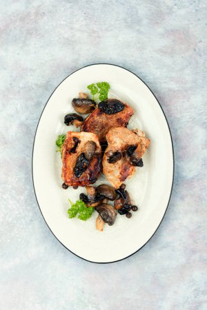 Photo for Pork tenderloin fillet meat with mushrooms on a plate. Medallions steaks. - Royalty Free Image