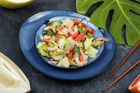 Photo for Diet salad with pomelo, shrimps and greens on a dark background. Healthy eating. - Royalty Free Image