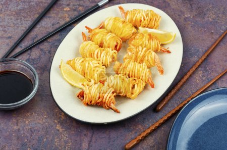 Photo for Fried rolled potato shrimps, prawns and potato rolls. Popular Asian food. Vietnamese cuisine. - Royalty Free Image