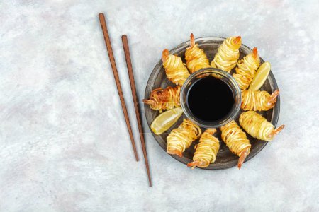 Photo for Fried rolled potato shrimps, prawns and potato rolls. Popular Asian food. Vietnamese cuisine. Copy space. - Royalty Free Image