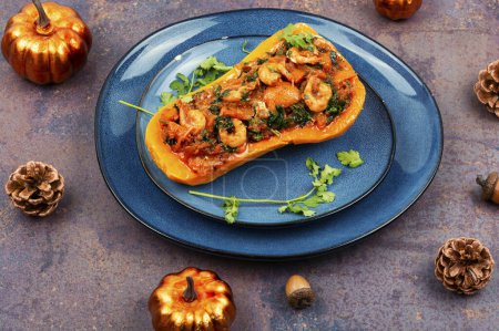 Photo for Half a tasty butternut squash stuffed with vegetables and shrimp. Healthy seasonal autumn food. - Royalty Free Image