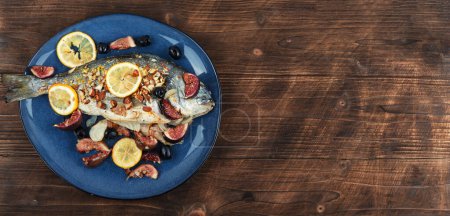 Photo for Baked dorado fish with almonds and figs. Autumn recipe. Space for text - Royalty Free Image