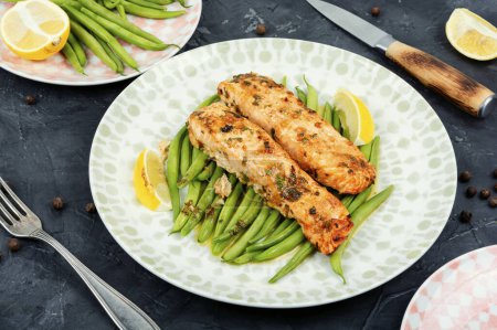 Photo for Fried salmon steaks garnished with bush green beans. Recipe. Ketogenic dinner. - Royalty Free Image