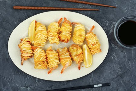 Photo for Fried rolled potato shrimps, prawns and potato rolls. Popular Asian food. Vietnamese cuisine. Flat lay. - Royalty Free Image