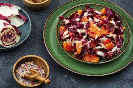 Photo for Appetizing salad with red radicchio and orange. Healthy vegetarian meal. - Royalty Free Image
