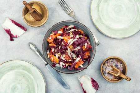 Photo for Appetizing salad with red radicchio and orange. - Royalty Free Image