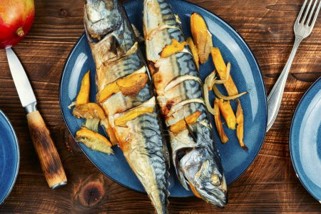 Photo for Appetizing mackerel fish roasted with mango. Scomber roast. Healthy homemade food. - Royalty Free Image