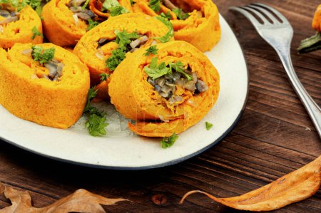 Photo for Delicious pumpkin dough rolls stuffed with mushrooms on vintage table. - Royalty Free Image