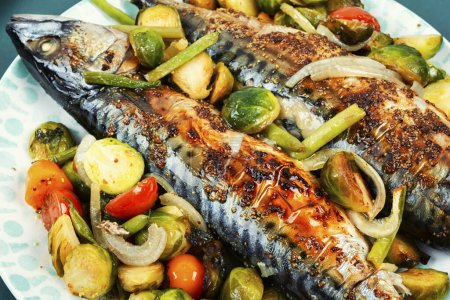 Photo for Plate with whole baked mackerel fish and tomatoes, cabbage and green beans - Royalty Free Image