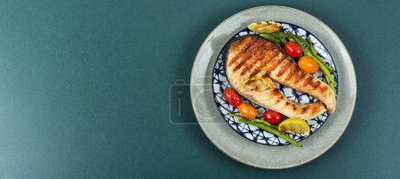 Photo for Grilled salmon steak with grilled vegetables, fried fish. Flat lay with copy space. - Royalty Free Image
