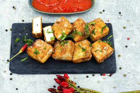 Photo for Roasted soy cheese tofu on the plate. - Royalty Free Image