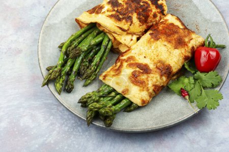 Photo for Appetizing omelette cooked with green asparagus. French cuisine - Royalty Free Image