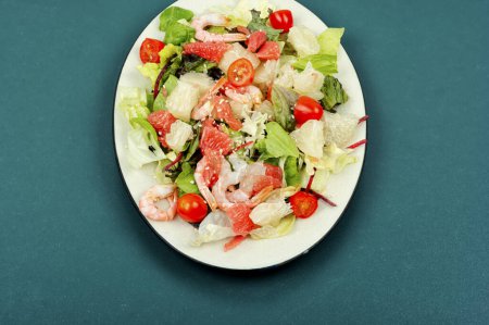Photo for Pomelo salad with shrimp, tomato cherry and lettuce. Concept of healthy eating. - Royalty Free Image