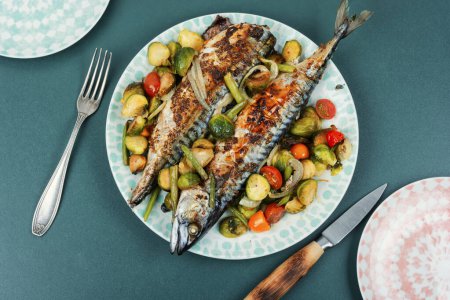 Photo for Roasted mackerel or scomber fish and tomatoes, cabbage and green beans. Top view. - Royalty Free Image