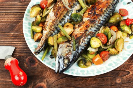 Photo for Baked mackerel fish and tomatoes, cabbage and green beans on dark wooden background - Royalty Free Image