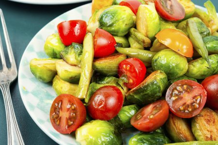 Photo for Homemade salad of fried brussels sprouts, tomato and green bush beans. - Royalty Free Image
