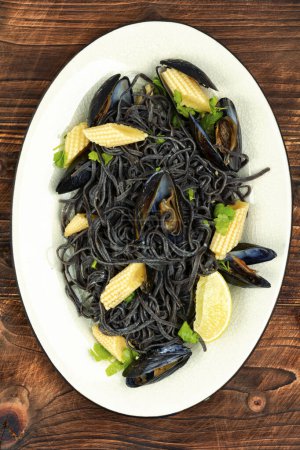 Photo for Vegan bean pasta with mussels. Mediterranean pasta vongole. Top view. - Royalty Free Image