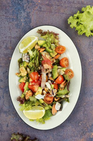 Photo for Tasty salad with fresh vegetables, seafood and fresh green lettuce. Healthy food concept. - Royalty Free Image