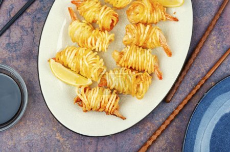 Photo for Fried rolls with shrimp and fries, prawn wrapped in potato. Asian food. - Royalty Free Image