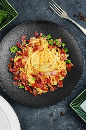 Photo for Pasta with carbonara sauce, bacon, parmesan and eggs. Top view. - Royalty Free Image