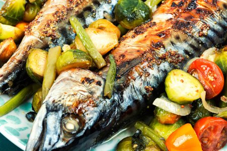 Photo for Baked mackerel fish and tomatoes, cabbage and green beans. Tasty fish, seafood. - Royalty Free Image