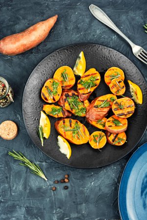 Photo for Grilled sweet potato, batata with olive oil and herbs. - Royalty Free Image