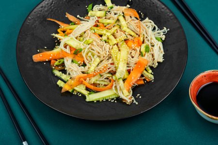Photo for Vegan salad with enoki mushrooms, carrots, cucumber, fried sesame seeds. Healthy diet concept. - Royalty Free Image