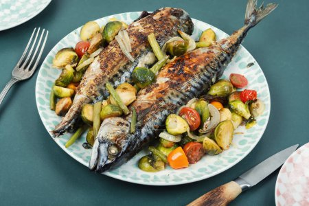 Photo for Plate with roasted mackerel or scomber fish and tomatoes, cabbage and green beans - Royalty Free Image