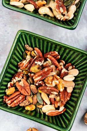 Photo for Mix of various nuts, pistachios, cashews, walnuts, peanuts and brazil nuts. Top view. - Royalty Free Image