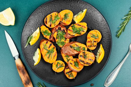 Photo for Tasty grilled baked yam or sweet potato with spices and herbs. Food recipe. - Royalty Free Image
