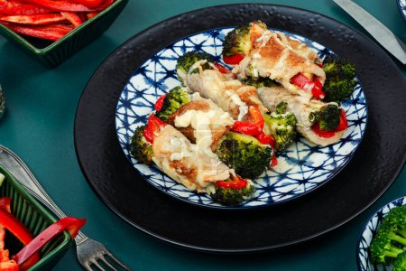 Photo for Roast pork meat roll with broccoli and bell pepper. Hot appetizing meal. - Royalty Free Image