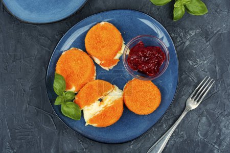 Photo for Toasted breaded and melted camembert cheese on the plate - Royalty Free Image